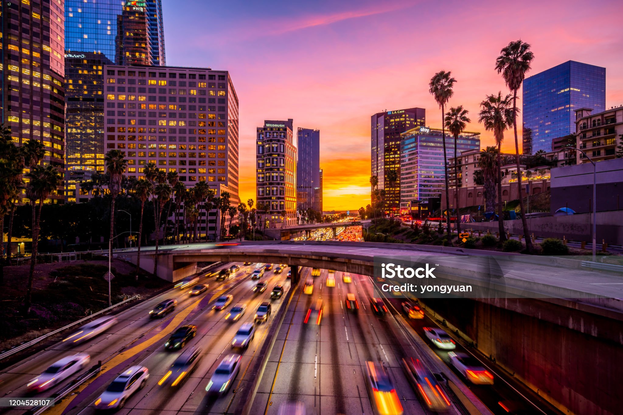 Busy traffic in Downtown Los Angeles at sunset