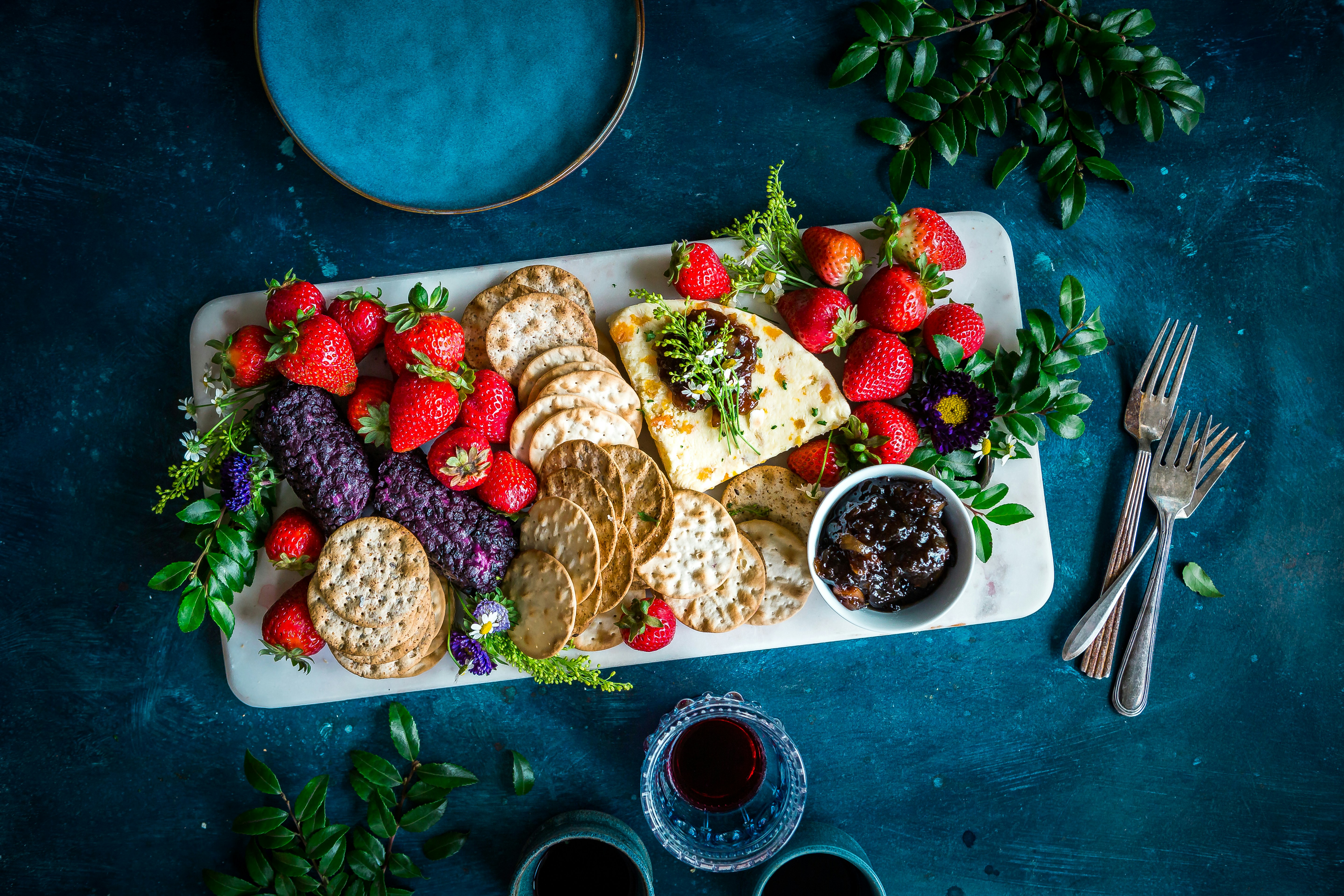 a plate topped with carckers and straberries