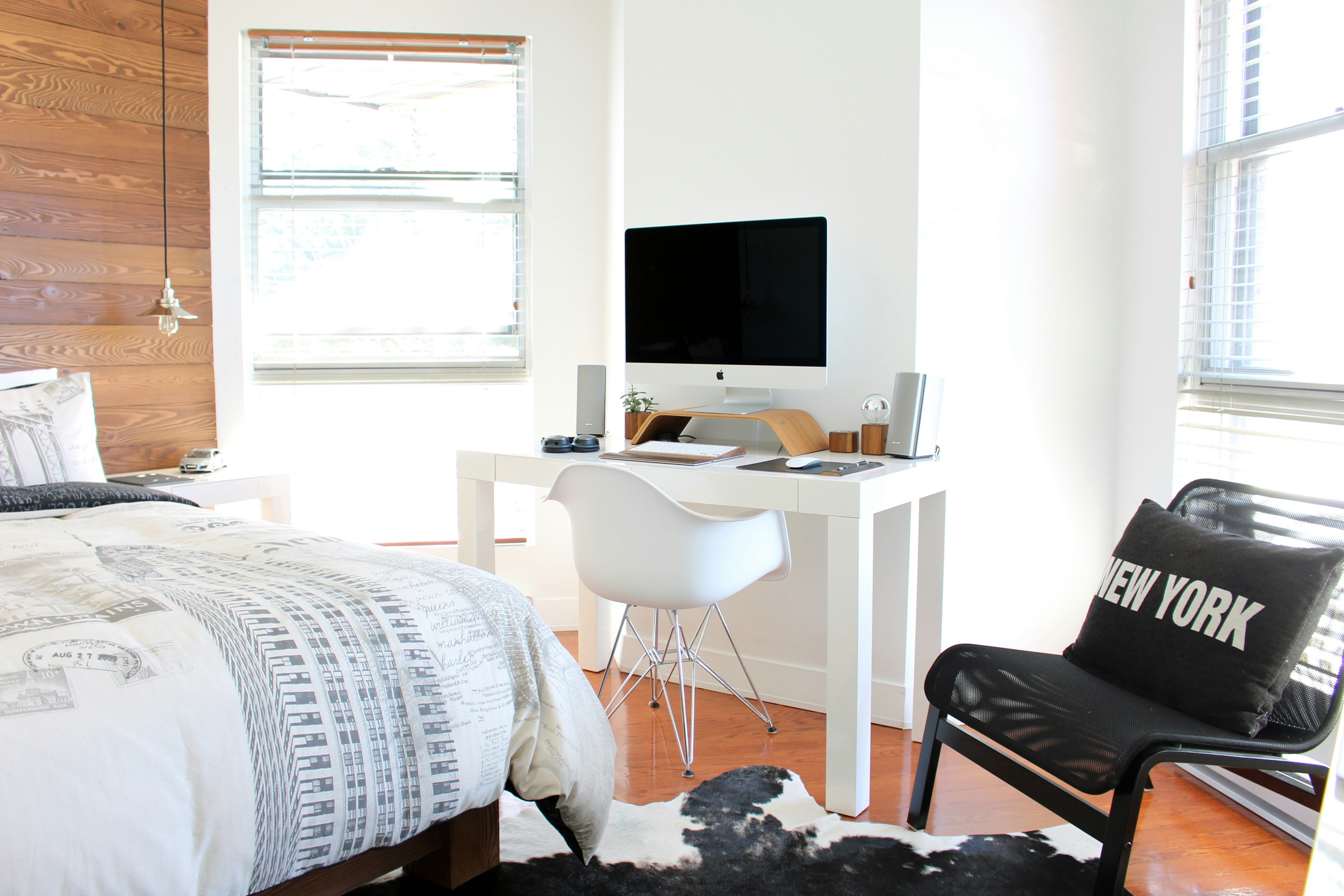 a bed, a chair and a computer