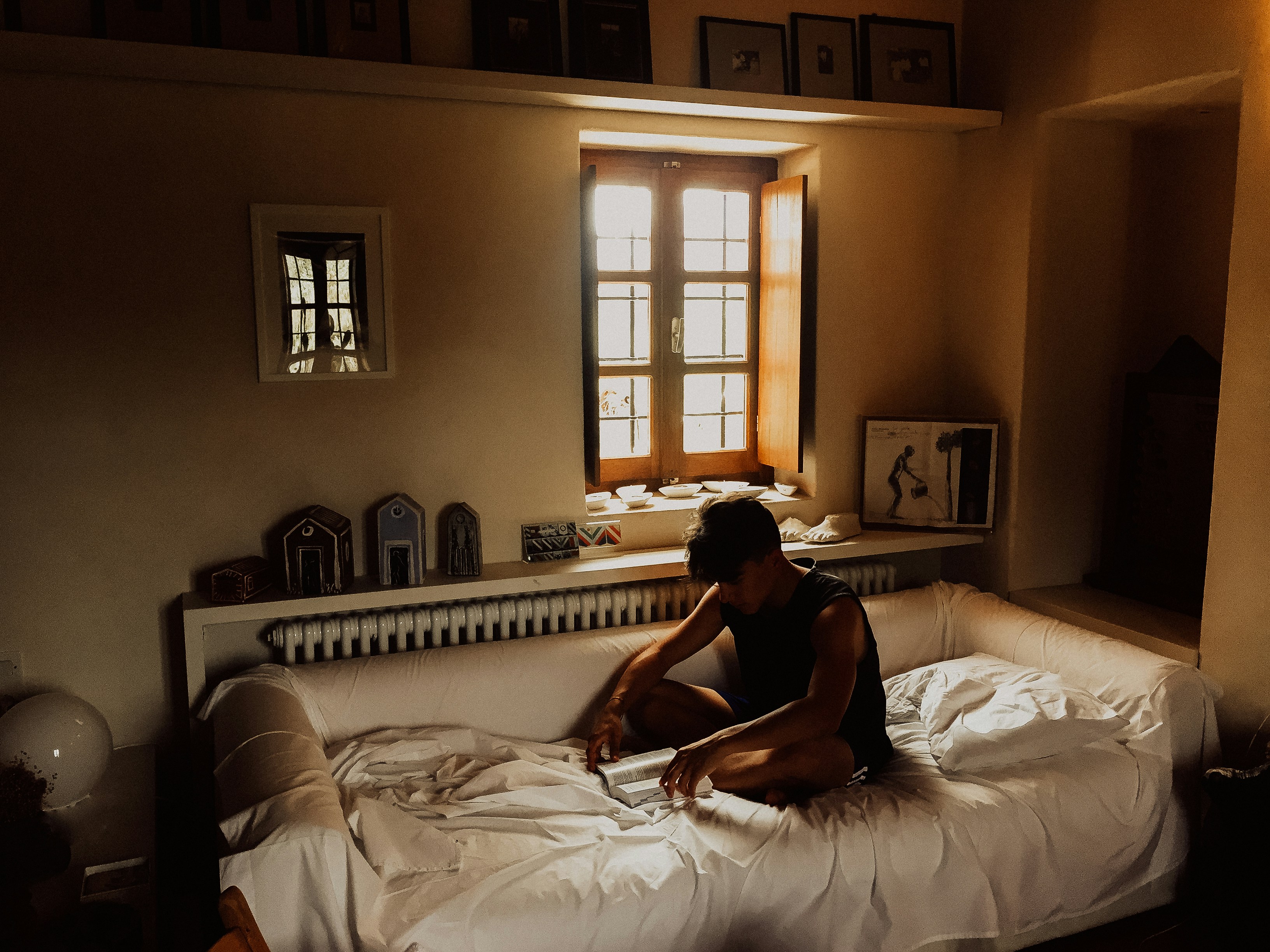 a man sitting on the bed