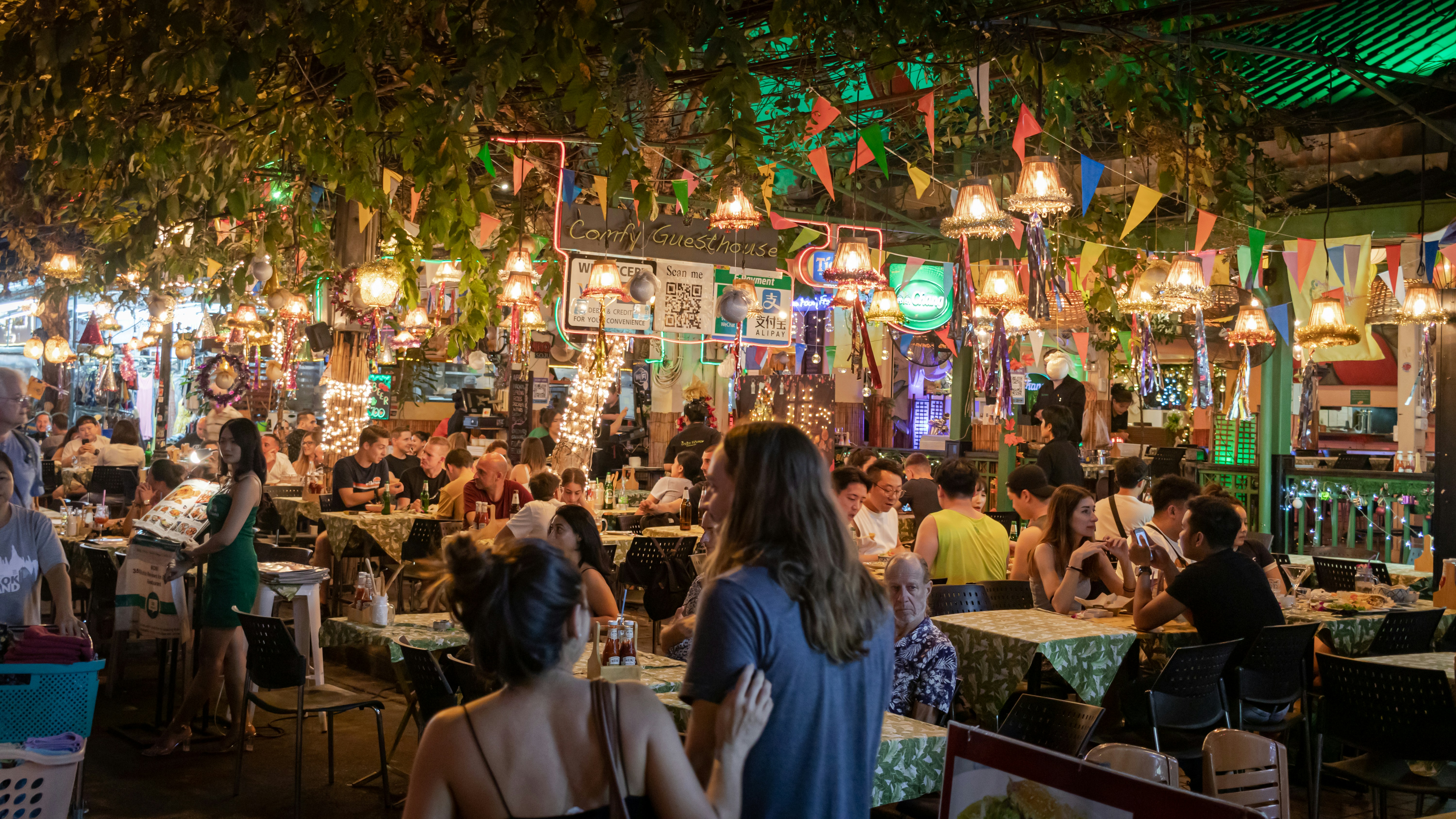 people dining in street restaurants