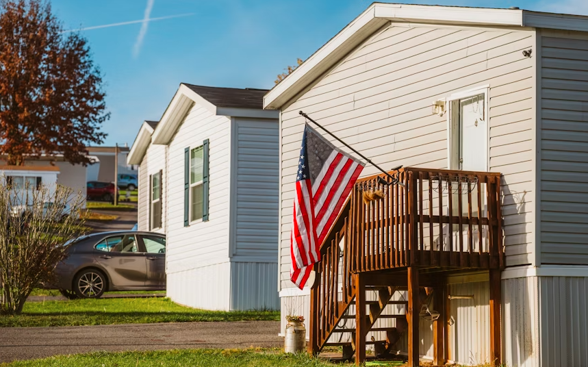 a white house with an american flag on the porch