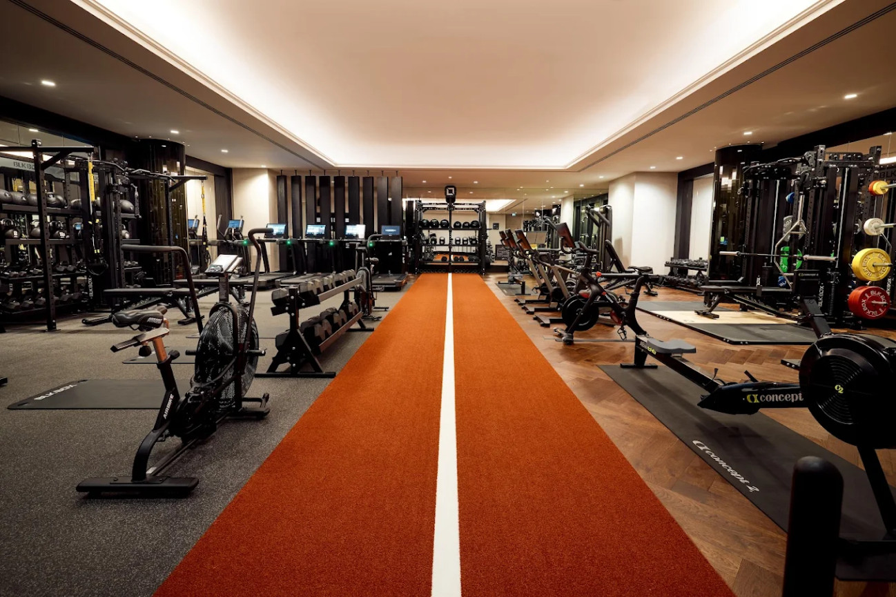 two brown carpets with many fitness equipments