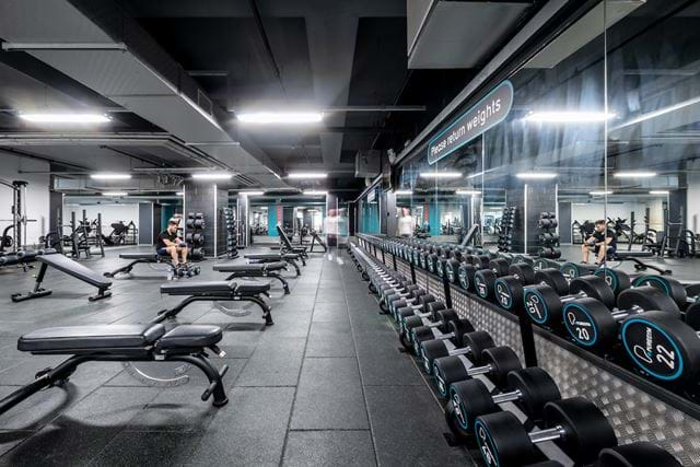 interior of a gym with a big mirror