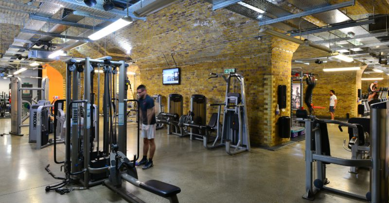two men using the fitness equipments