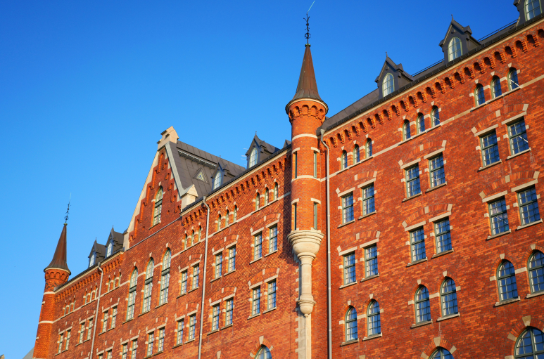 large red brick school building with a clock tower