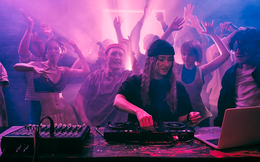 a DJ mixing in front of many people